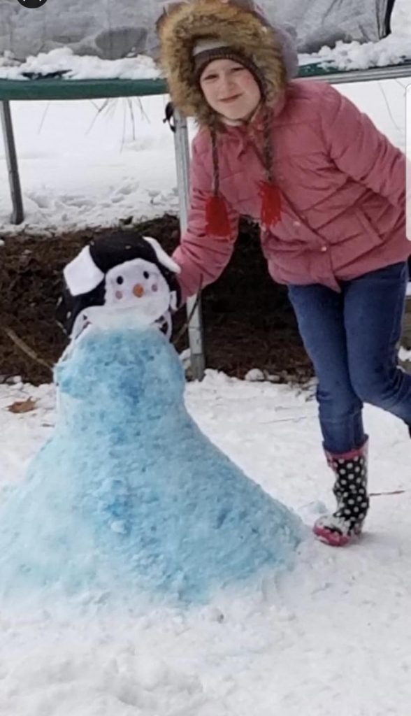 NAES Student with Snowman