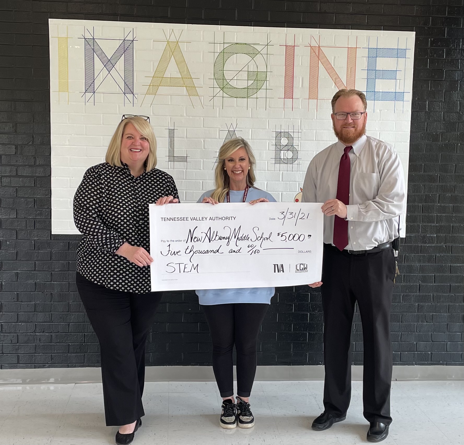 Pictured l-r: Amy Tate, TVA Government Relations Manager; Sarah Garrett, Imagine Lab Coordinator; and Paul Henry, NAMS Principal (check presentation)