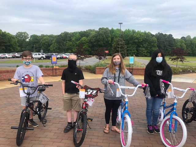 Writing Contest Winners with their bike:  Colton Roberts, Jason Ross, Morgan Pierce, and Natalie Aguilar 