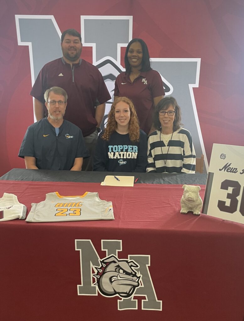 On Thursday, February 23, New Albany Lady Bulldog Basketball's Abby Laney signed to play basketball with Blue Mountain Christian University.   Pictured are front row l-r: Philip Laney, Abby Laney, Alison Laney; back row l-r: Coach Cody Stubblefield, Athletic Director and Coach Micha Washington, NAHS Head Girls Basketball Coach.