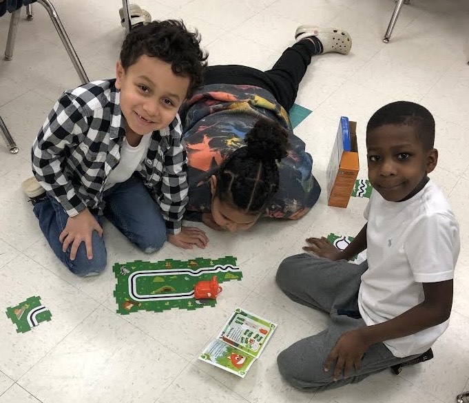 Students in Robin Willis' 1st grade class at New Albany Elementary School enjoy a game to learn more about coding. These resources were purchased through a school grant made possible by the Dean Provence Endowment for Excellence in Education.