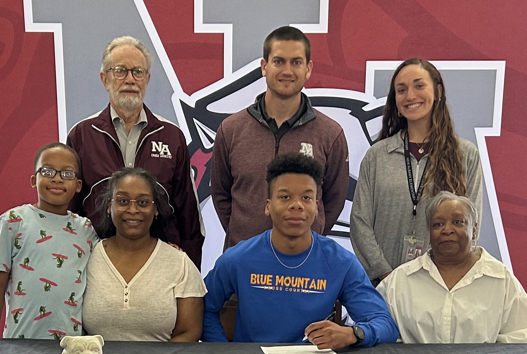 New Albany Bulldog Runner Lelan Boulden signed to run cross country for Blue Mountain Christian University on Friday, March 10. Pictured are front row l-r: Dillen Cook, Karen Jumper, Lelan Boulden, Glenda Wilson; back row l-r: Assistant Cross Country Coach Mike Beam, Head Cross Country Coach Austin Epting, Assistant Cross Country Cross Hannah Covington.