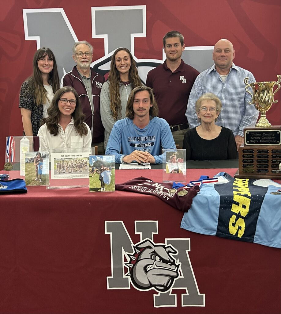 New Albany Bulldog Runners Dawson Boyd and Erick Flores signed to run cross-country for Blue Mountain Christian University on Friday, March 31. Boyd PicturePictured front row l-r:  Haven Boyd, Dawson Boyd, Brenda Boyd; back row l-r:  Lauren Cissom, NAHS Assistant Cross Country Coach Mike Beam, NAHS Assistant Cross Country Coach Hannah Covington, NAHS Head Cross Country Coach Austin Epting, and Harvey Boyd. Flores PicturePictured front row l-r: Martin Flores, Erick Flores, Sandy Velazquez; back row l-r:  Katie Flores, NAHS Assistant Cross Country Coach Mike Beam, NAHS Assistant Cross Country Coach Hannah Covington, and NAHS Head Cross Country Coach Austin Epting. 
