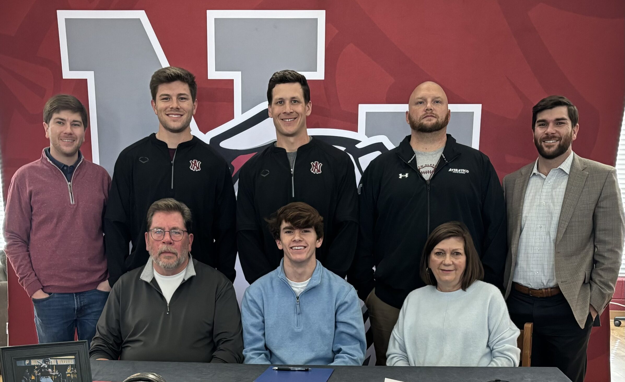New Albany Bulldog Baseball Player Cooper Dodds signed to play baseball for Blue Mountain Christian University on Thursday, February 1. Pictured front row l-r:  Frank Dodds; Cooper Dodds; Tammie Dodds; back row l-r: Wesley Dodds; Eli Jackson, NAHS Assistant Baseball Coach; Drew Wheeler, NAHS Head Baseball Coach; Drew Davis, NAHS Trainer; Drew Dodds.