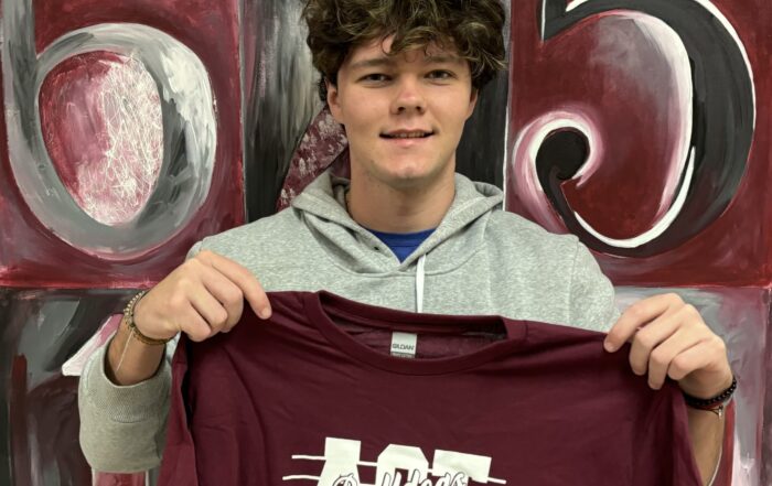 New Albany High School presented an ACT 30+ Club t-shirt to Carson Taylor on February 26, 2024 for his recent success on the ACT. Students who have a composite or subscore of 30 or more on their recent ACT are inducted into the club. More than 200 students have become members of the ACT 30+ Club since its creation in the fall of 2009.
