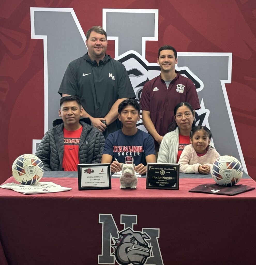 On Wednesday, March 20, New Albany Bulldog Soccer's Hector Marcial signed to play soccer with Itawamba Community College. Pictured are front row l-r: Roberto Marcial, Hector Marcial, Edit Hernandez, and Valeria Marcial; back row l-r: NAHS Athletic Director Cody Stubblefield and NAHS Head Coach Austin Baker.