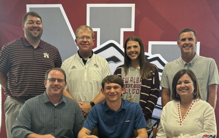 New Albany Bulldog Tennis Player Carter Ladner signed to play tennis for Northeast Mississippi Community College on Tuesday, April 30. Pictured front row l-r:  Dr. Damon Ladner, Carter Ladner, Dr. Rachel Ladner; back row NAHS Athletic Director Cody Stubblefield, NAHS Head Tennis Coach Shane Sanderson, NAHS Assistant Tennis Coach Mary Fran Reaves, and NAHS Assistant Tennis Coach Brad Clayton.