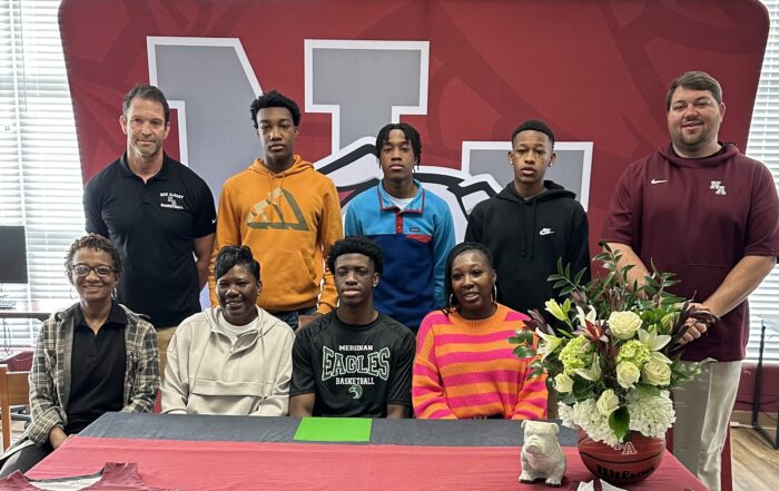 On Friday, April 12 New Albany Bulldog Boys Basketball's Kylan Lindsey signed to play basketball with Meridian Community College. Pictured front row l-r: Xavier Tillman, Barbara Washington, Kylan Lindsey, and Portia Dixon; back row l-r: Scotty Shettles, NAHS Head Boys Basketball Coach, Kameron Carruthers, Kayden Carruthers, Kamari Johnson, and Cody Stubblefield, NAHS Athletic Director